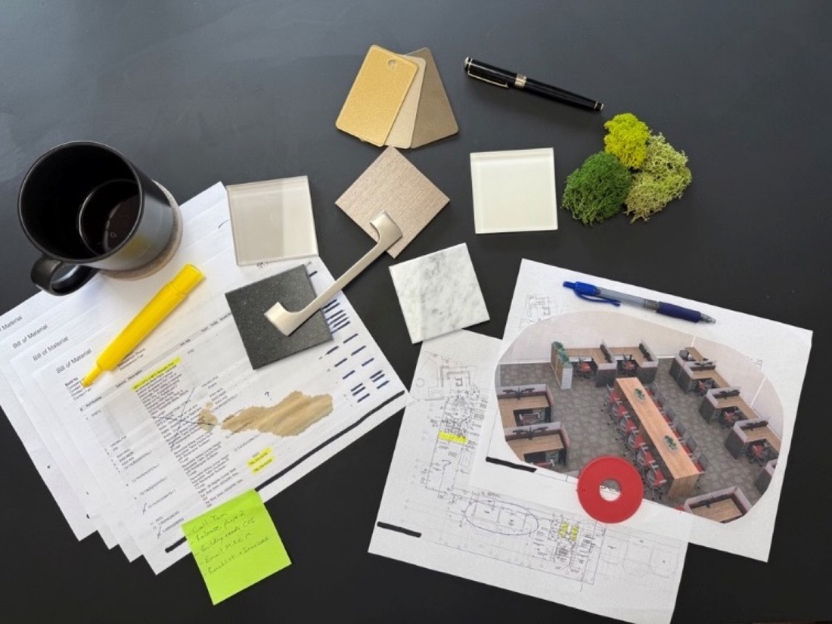 Finish samples, a bill of materials, a floor plan and a 3D workstation rendering on a COI project desk